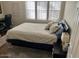 Bedroom featuring a bed, ceiling fan, desk, and an abundance of natural light from a large window at 5132 N 31St Way # 112, Phoenix, AZ 85016