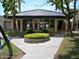 Community clubhouse features a unique roof, manicured grounds, and a welcoming entrance at 5132 N 31St Way # 112, Phoenix, AZ 85016