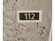 Close-up image of the address marker reading '112' on a stucco wall at 5132 N 31St Way # 112, Phoenix, AZ 85016