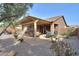 Backyard patio with pergola and desert landscaping at 5181 W Buckskin Dr, Eloy, AZ 85131