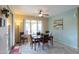 Bright dining room with sliding glass doors leading to the backyard at 5181 W Buckskin Dr, Eloy, AZ 85131