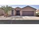 Single-story home with desert landscaping and a two-car garage at 5181 W Buckskin Dr, Eloy, AZ 85131