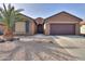 One-story home with a two-car garage and desert landscaping at 5181 W Buckskin Dr, Eloy, AZ 85131