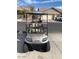 Tan golf cart with added accessories and headlights at 5181 W Buckskin Dr, Eloy, AZ 85131