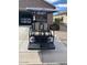 Black and tan golf cart with added accessories at 5181 W Buckskin Dr, Eloy, AZ 85131