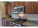 Kitchen features stainless steel appliances and granite countertops at 5181 W Buckskin Dr, Eloy, AZ 85131