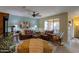 Living room with leather sofas and a rustic wooden entertainment center at 5181 W Buckskin Dr, Eloy, AZ 85131