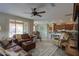 Spacious living room featuring leather furniture and views to the kitchen and backyard at 5181 W Buckskin Dr, Eloy, AZ 85131