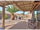 Covered patio with seating area and fire pit at 5181 W Buckskin Dr, Eloy, AZ 85131