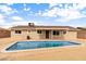 Backyard features a refreshing pool, desert landscaping and the rear of the single story home at 5313 W Osborn Rd, Phoenix, AZ 85031