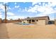 Spacious backyard with a refreshing swimming pool, desert landscaping and a patio at 5313 W Osborn Rd, Phoenix, AZ 85031