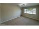 Bright bedroom with window and neutral wall colors at 5313 W Osborn Rd, Phoenix, AZ 85031