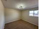 Bright bedroom featuring a large window and neutral decor at 5313 W Osborn Rd, Phoenix, AZ 85031