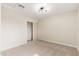 Cozy bedroom featuring neutral carpet, modern lighting, and closet with sliding doors at 5313 W Osborn Rd, Phoenix, AZ 85031