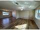 Open living room featuring hardwood floors and neutral walls at 5313 W Osborn Rd, Phoenix, AZ 85031