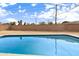 Swimming pool surrounded by a low maintenance desert landscape and block fencing at 5313 W Osborn Rd, Phoenix, AZ 85031