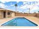 Sparkling swimming pool with blue tile in a low maintenance backyard at 5313 W Osborn Rd, Phoenix, AZ 85031