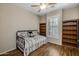 Small bedroom with daybed and wooden bookcases at 6238 W Buckhorn Trl, Phoenix, AZ 85083