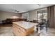 Kitchen with island, light wood cabinets, and granite countertops at 6238 W Buckhorn Trl, Phoenix, AZ 85083