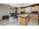 Kitchen with light wood cabinets, granite countertops, and stainless steel appliances at 6238 W Buckhorn Trl, Phoenix, AZ 85083