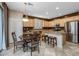 Kitchen with light wood cabinets, granite countertops, and stainless steel appliances at 6238 W Buckhorn Trl, Phoenix, AZ 85083