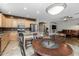 Kitchen with island, stainless steel appliances, and adjacent dining area at 6238 W Buckhorn Trl, Phoenix, AZ 85083