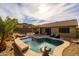 Inviting kidney-shaped pool with surrounding patio and seating at 6238 W Buckhorn Trl, Phoenix, AZ 85083