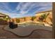 Beautiful kidney shaped pool with a waterfall feature at 6238 W Buckhorn Trl, Phoenix, AZ 85083