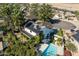 An aerial view of a home showcasing a pool, solar panels, and mature landscaping on an expansive lot at 6811 E Juniper Ave, Scottsdale, AZ 85254