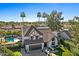 Beautiful two-story home featuring a manicured lawn, mature trees, and a stylish attached garage at 6811 E Juniper Ave, Scottsdale, AZ 85254