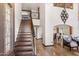 Grand foyer with staircase and elegant chandelier at 6811 E Juniper Ave, Scottsdale, AZ 85254