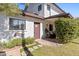 Charming home entrance with well-maintained landscaping and a cozy sitting area at 6811 E Juniper Ave, Scottsdale, AZ 85254