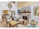 Elegant living room with a stone fireplace and sophisticated seating arrangement at 6811 E Juniper Ave, Scottsdale, AZ 85254