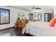 Bright main bedroom featuring a large window, dresser, and ensuite bathroom entrance at 6811 E Juniper Ave, Scottsdale, AZ 85254