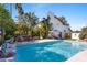 Resort-style pool, outdoor kitchen, and beautiful landscaping creating an inviting and luxurious outdoor oasis at 6811 E Juniper Ave, Scottsdale, AZ 85254