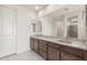 Bathroom with double sink vanity and a large mirror at 7163 W Oberlin Way, Peoria, AZ 85383