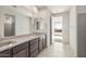 Bathroom featuring a double sink vanity with dark wood cabinets at 7163 W Oberlin Way, Peoria, AZ 85383