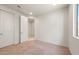 Bright bedroom features neutral carpet, white walls, and a door to the hallway at 7163 W Oberlin Way, Peoria, AZ 85383