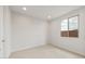 Bright bedroom with carpet flooring and a window at 7163 W Oberlin Way, Peoria, AZ 85383