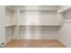 Walk-in closet with shelving and rack system at 7163 W Oberlin Way, Peoria, AZ 85383