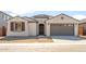 Charming single-story home with a tile roof, stucco finish and a two-car garage at 7163 W Oberlin Way, Peoria, AZ 85383