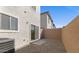 Small backyard with gravel and a sliding glass door at 7563 W Donner Dr, Laveen, AZ 85339