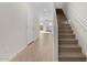 Modern stairwell with light wood flooring at 7563 W Donner Dr, Laveen, AZ 85339