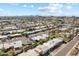 Aerial view of houses and community landscape with mountains in the background at 7714 E Mariposa Dr, Scottsdale, AZ 85251