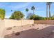 Landscaped backyard with gravel, rocks, and a short wall at 7714 E Mariposa Dr, Scottsdale, AZ 85251