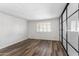 Light and airy bedroom featuring wood-look floors and a large closet at 7714 E Mariposa Dr, Scottsdale, AZ 85251