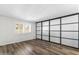 Bright bedroom with wood-look floors and large closet with sliding doors at 7714 E Mariposa Dr, Scottsdale, AZ 85251