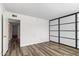 Bright bedroom with wood-look floors and sliding doors at 7714 E Mariposa Dr, Scottsdale, AZ 85251