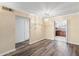 Spacious dining room with wood-look floors and chandelier at 7714 E Mariposa Dr, Scottsdale, AZ 85251