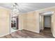 Dining room features wood-look floors and a chandelier at 7714 E Mariposa Dr, Scottsdale, AZ 85251